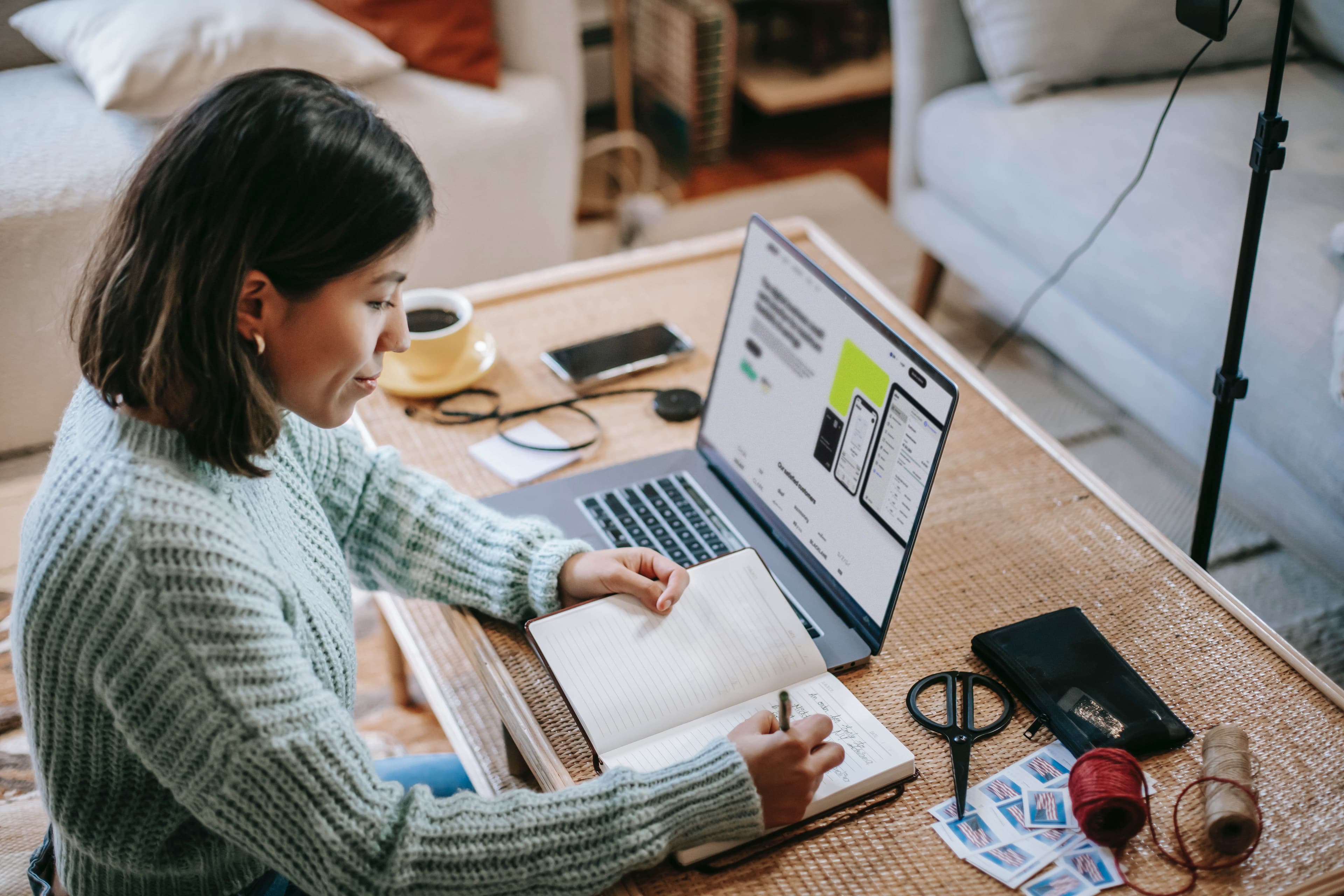 female entrepreneur entering records of expenses